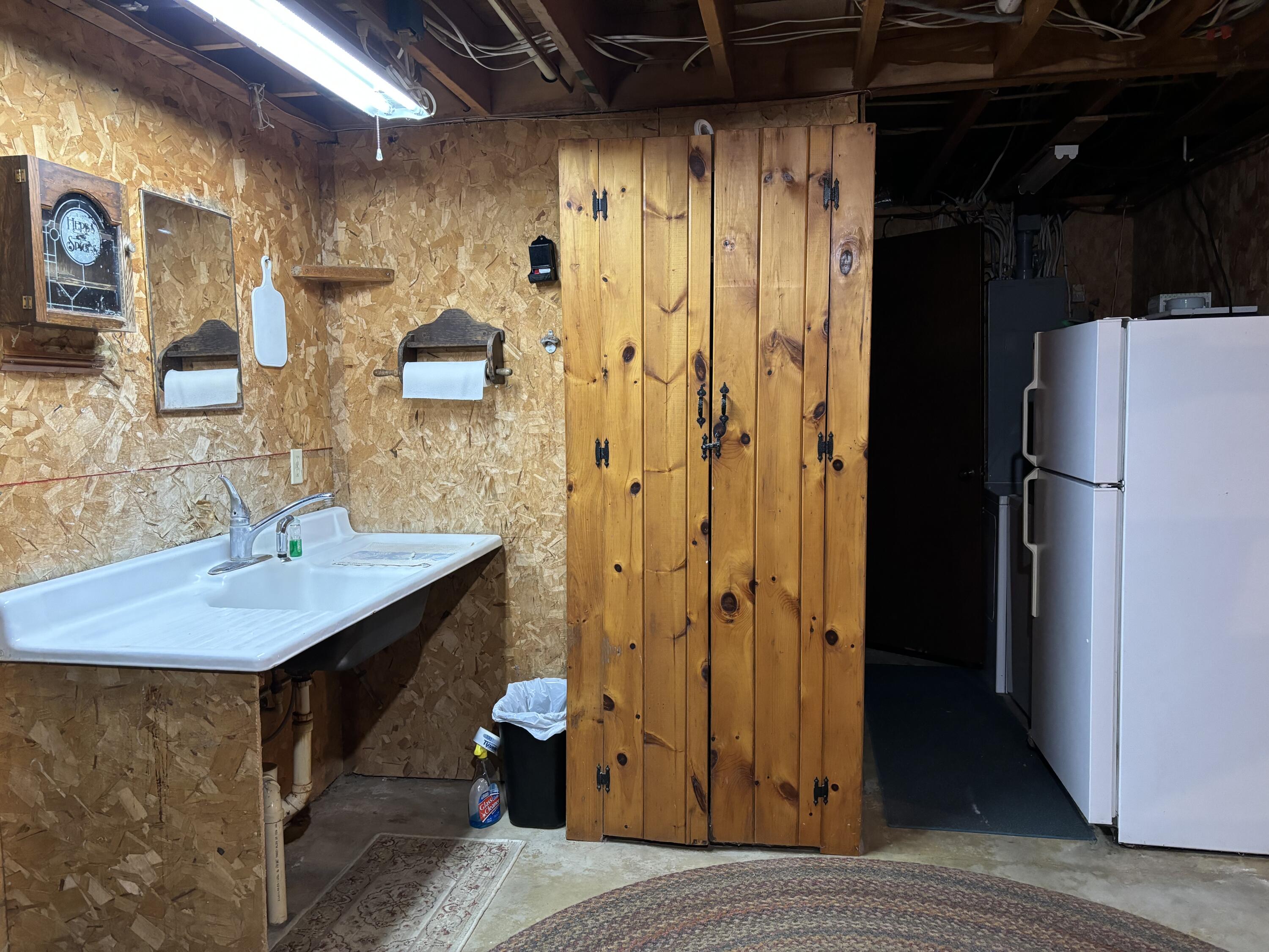 47 North Road Winterport, ME 04496 - Photo 44 of 56 Basement sink and fridge