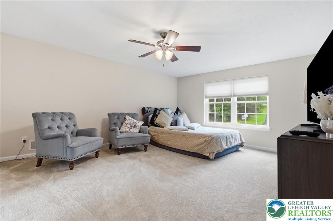 5032 Custard Road Stroudsburg, PA 18360 - Photo 35 of 80 Plentiful natural light fills this bedroom featuring wall-to-wall carpeting and neutral finishes.