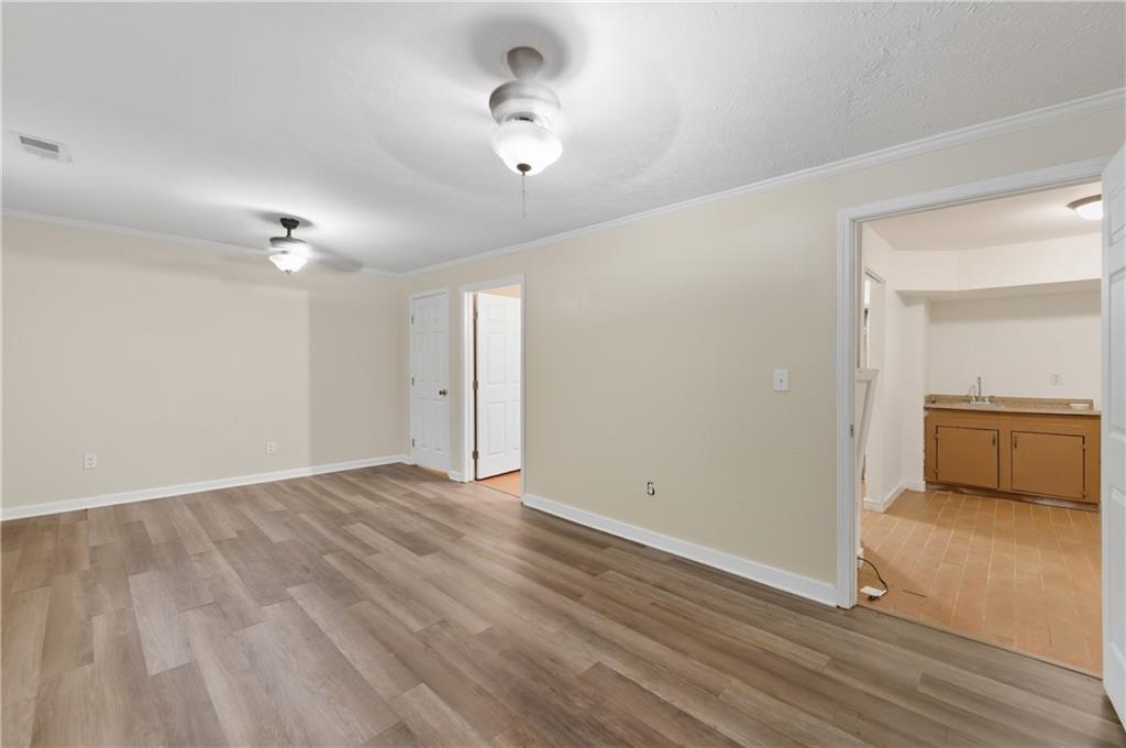 2139 Trailwood Road Decatur, GA 30032 - Photo 12 of 21 wooden floor in an empty room with a window