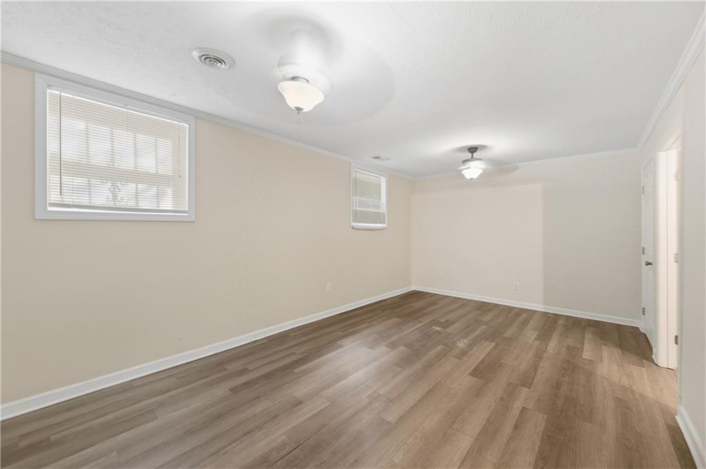 2139 Trailwood Road Decatur, GA 30032 - Photo 13 of 21 an empty room with wooden floor and windows