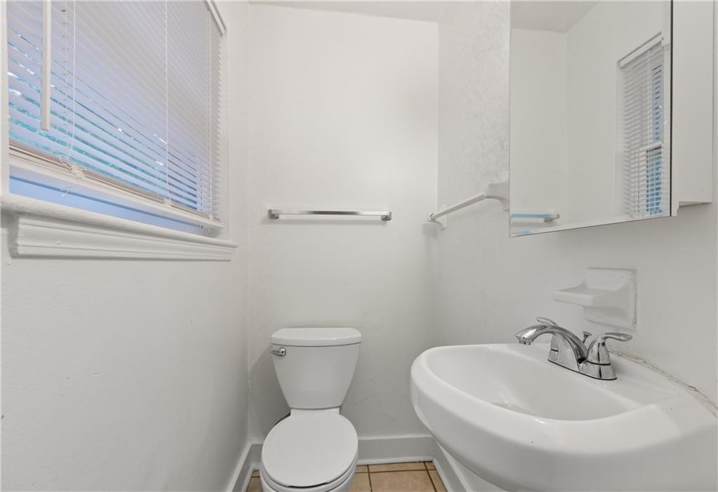 2139 Trailwood Road Decatur, GA 30032 - Photo 19 of 21 a white toilet sitting next to a bathroom sink