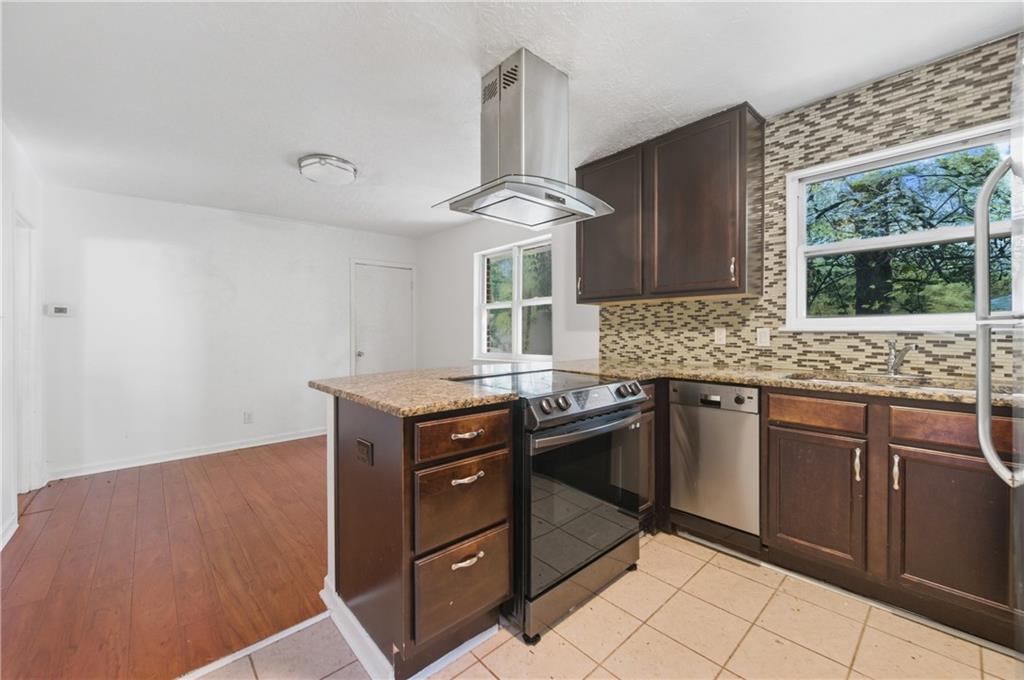 2139 Trailwood Road Decatur, GA 30032 - Photo 4 of 21 a kitchen with granite countertop a sink cabinets and window