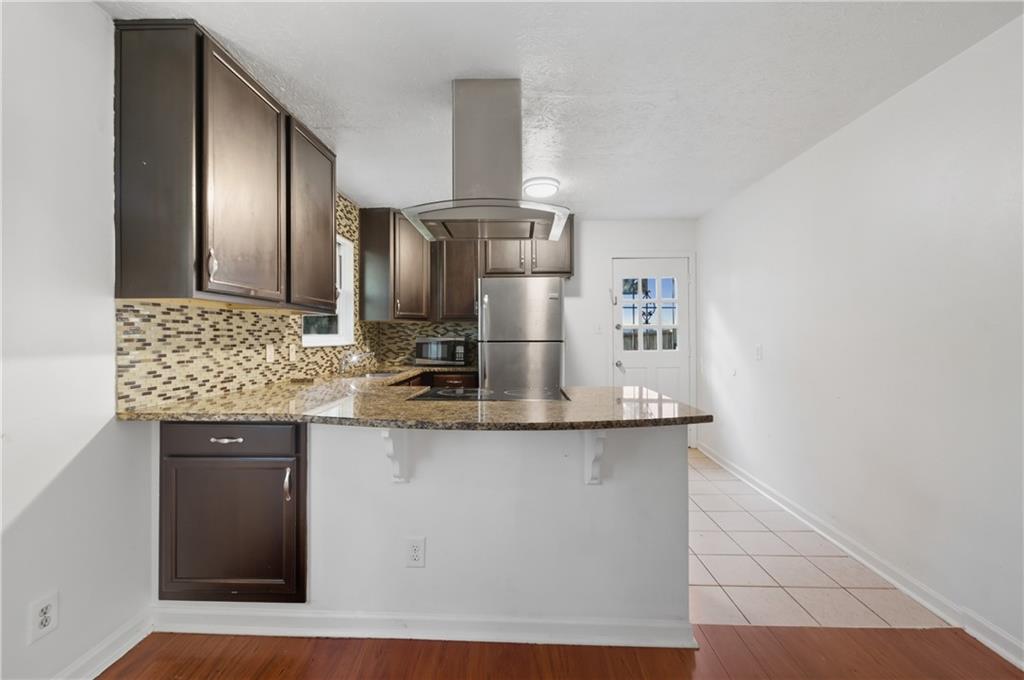 2139 Trailwood Road Decatur, GA 30032 - Photo 5 of 21 a kitchen with stainless steel appliances granite countertop a sink and a refrigerator