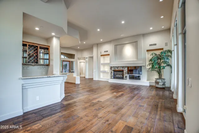 a bathroom with a granite countertop shower mirror and a sink