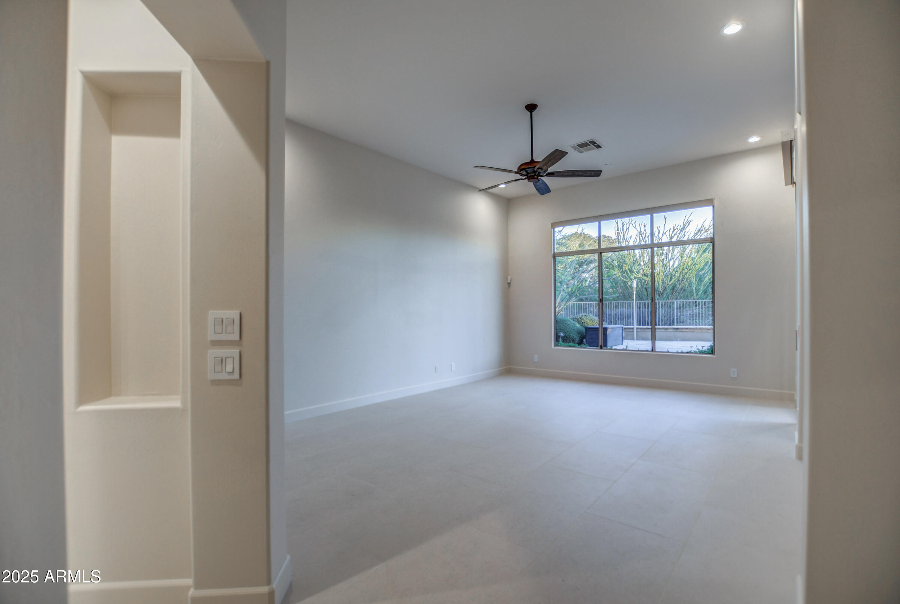 9671 East Monument Drive Scottsdale, AZ 85262 - Photo 35 of 124 an empty room with windows and ceiling fan