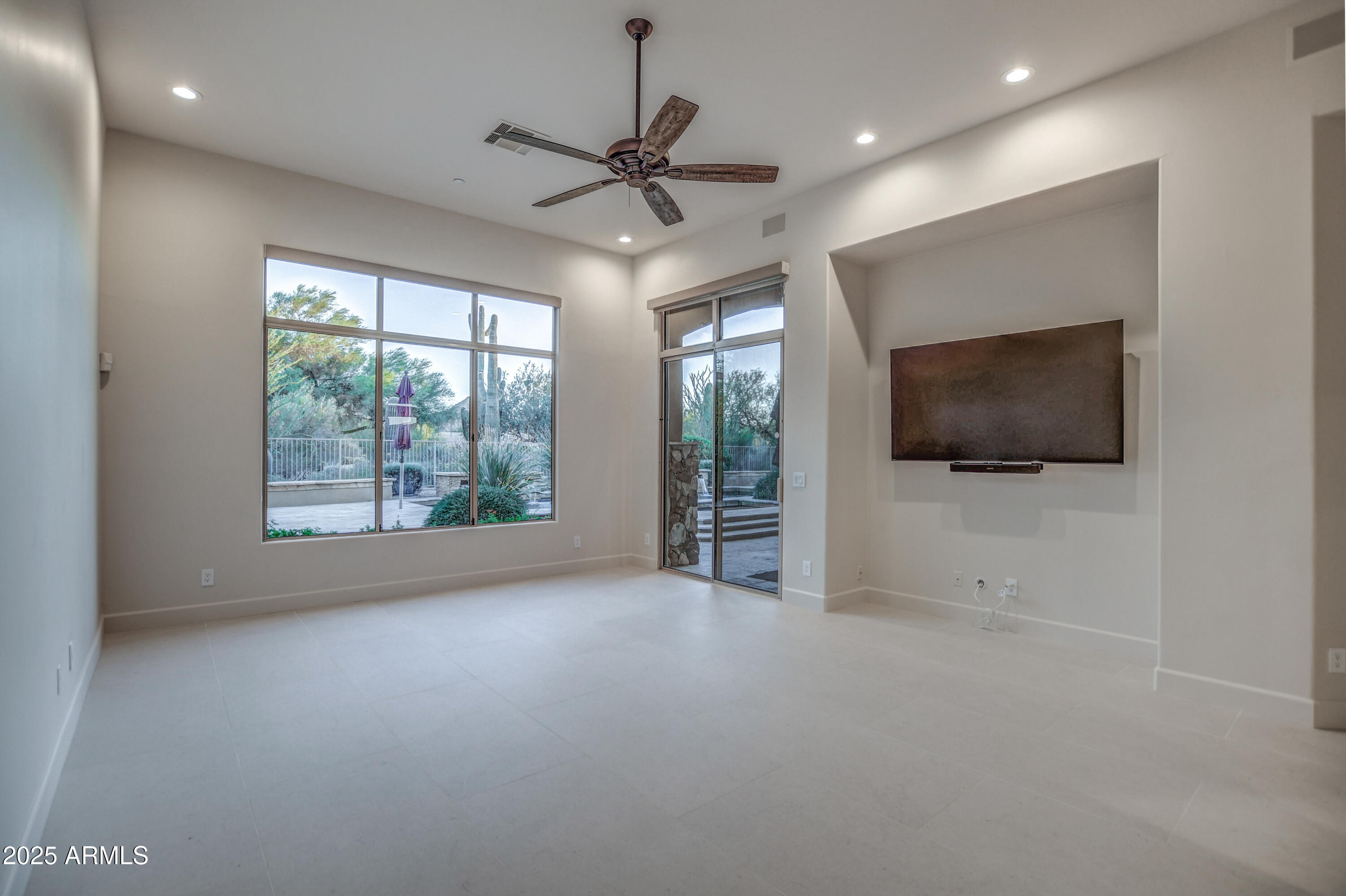 9671 East Monument Drive Scottsdale, AZ 85262 - Photo 36 of 124 a view of a livingroom with an empty space and a window