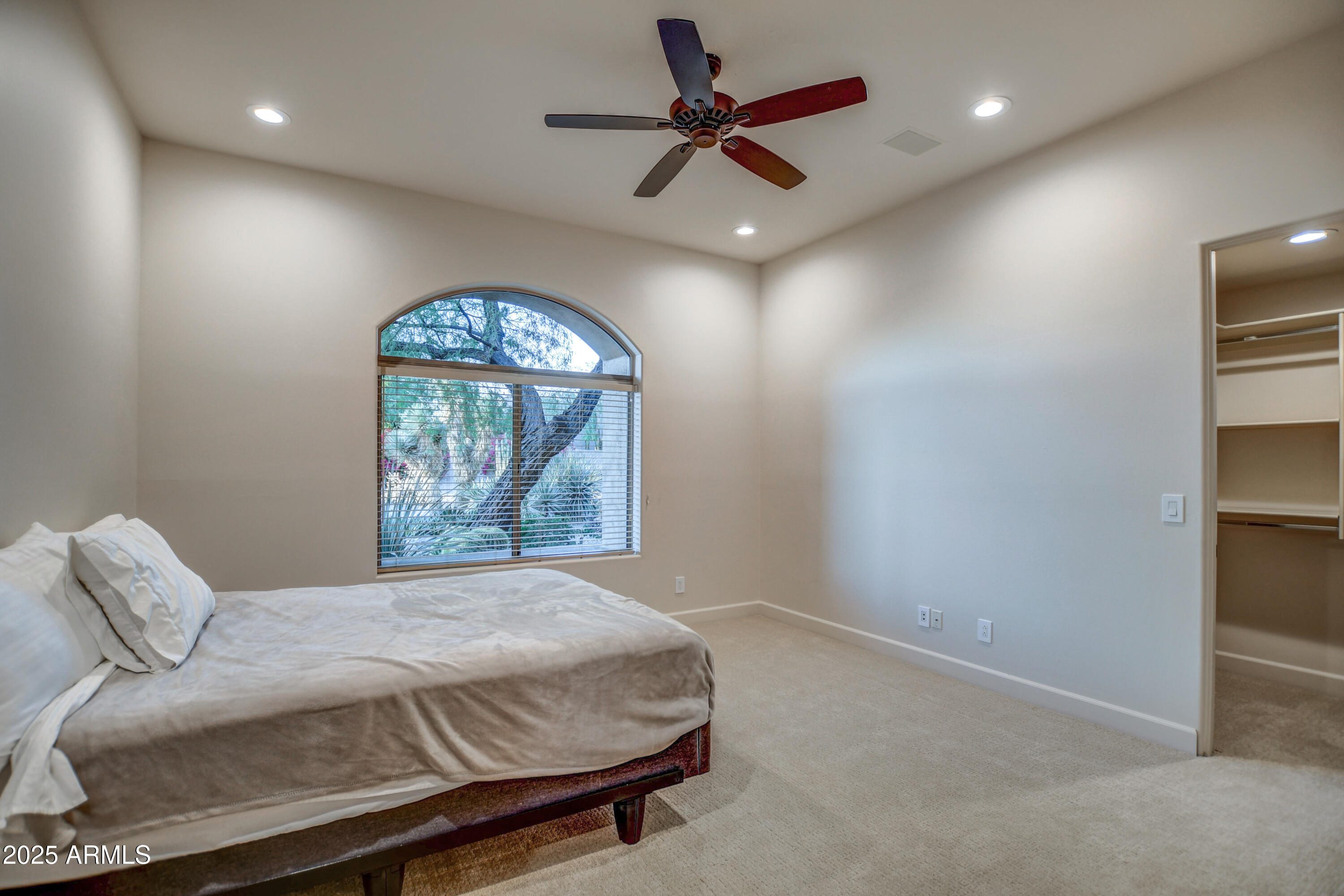 9671 East Monument Drive Scottsdale, AZ 85262 - Photo 42 of 124 a bedroom with a bed and a painting on the wall