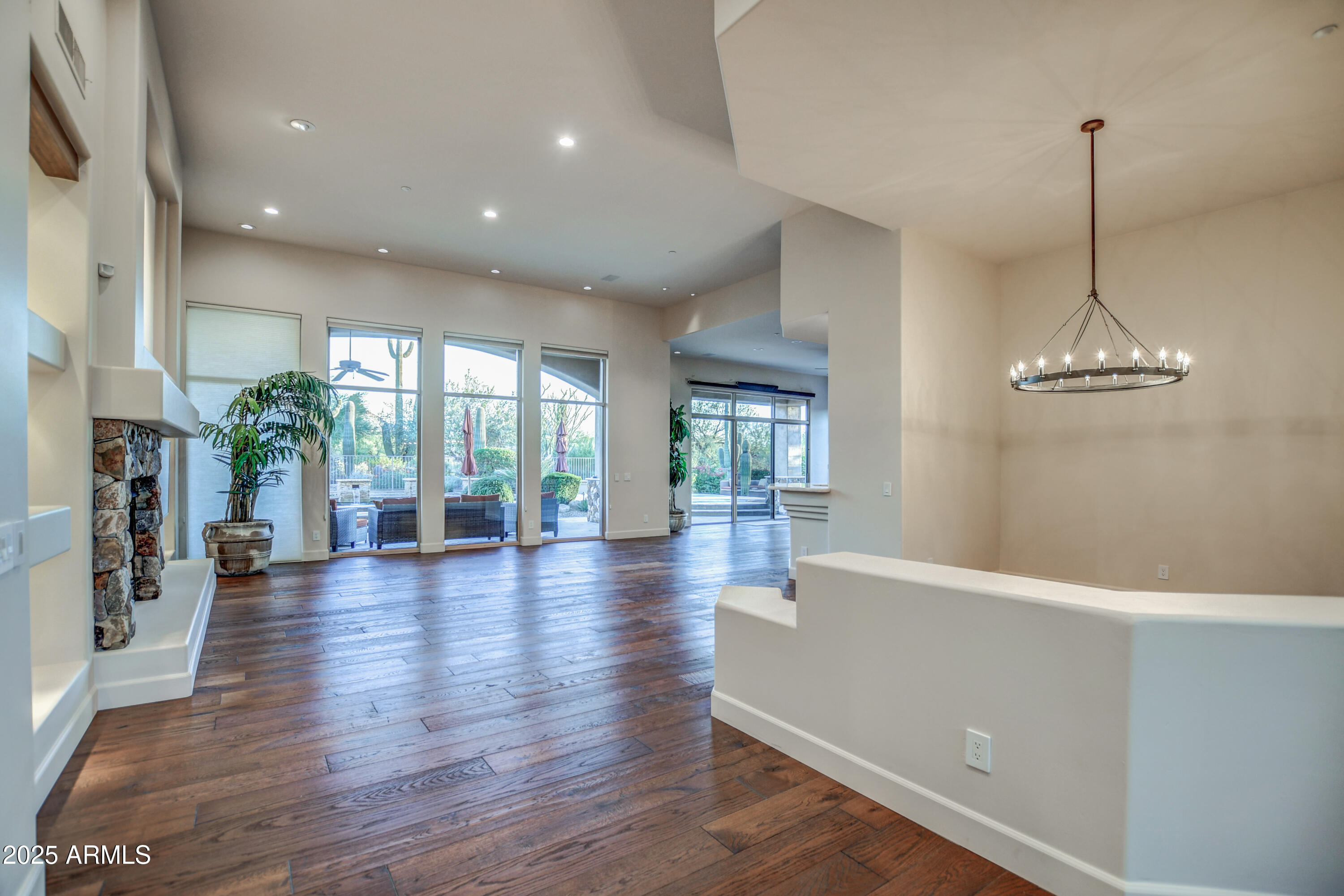 9671 East Monument Drive Scottsdale, AZ 85262 - Photo 54 of 124 a view of empty room with wooden floor and floor to ceiling window