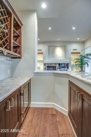 a kitchen with stainless steel appliances granite countertop a sink a stove and a refrigerator