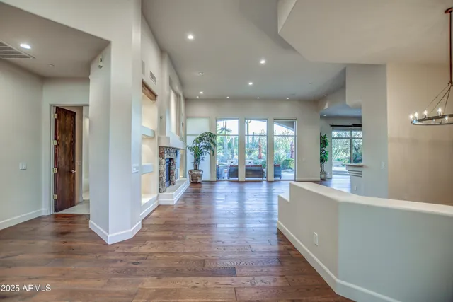 an open kitchen with a sink and stove top oven