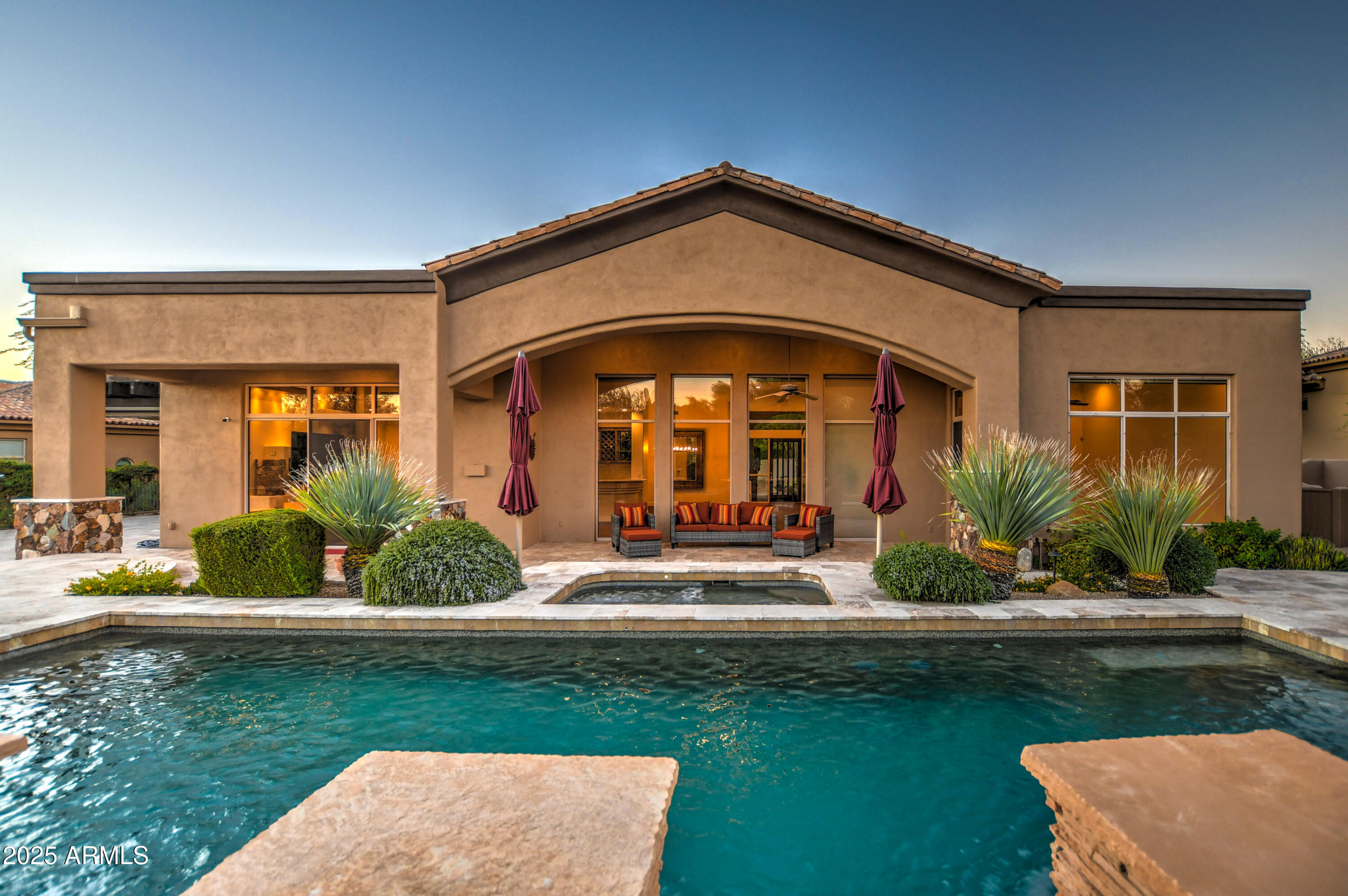 9671 East Monument Drive Scottsdale, AZ 85262 - Photo 84 of 124 a front view of a house with garden
