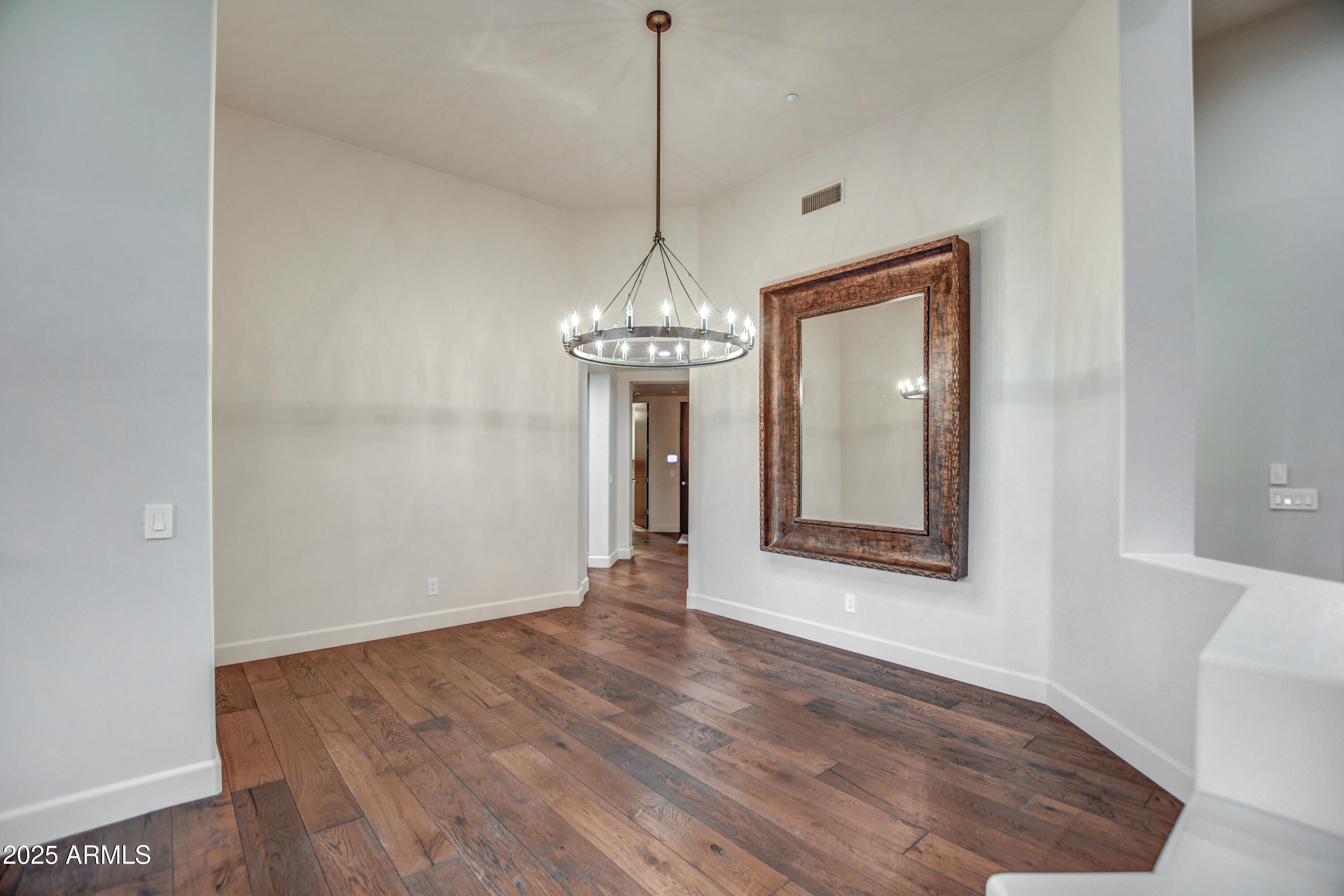 9671 East Monument Drive Scottsdale, AZ 85262 - Photo 8 of 124 a view of a room with wooden floor and entryway