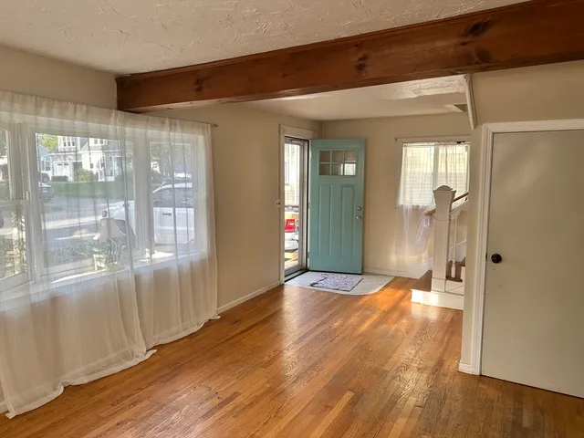 a view of entryway with wooden floor