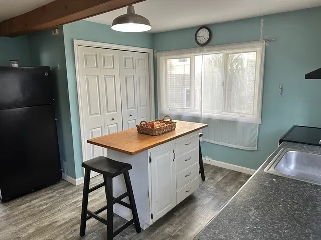 a kitchen with a table and chairs