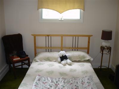 525 Governor Prence Road Eastham, MA 02642 - Photo 7 of 8 a large bed sitting in a bedroom next to a window
