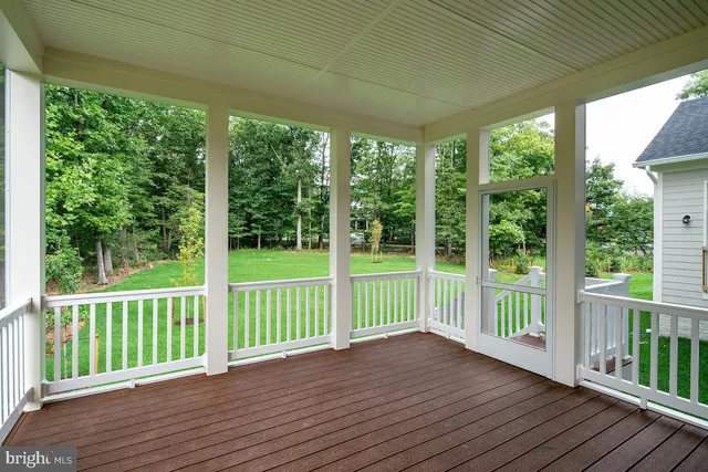 a view of a deck with wooden floor and outdoor space