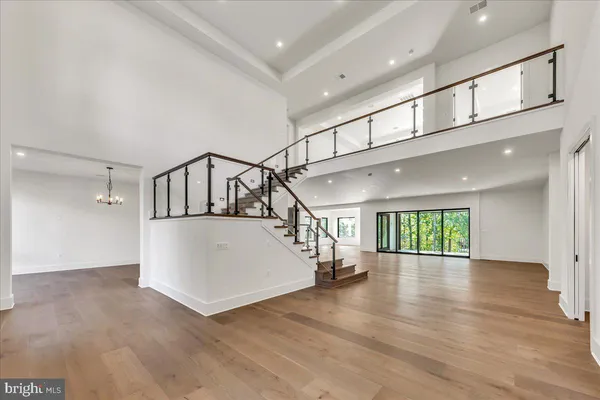 a view of an entryway with wooden floor