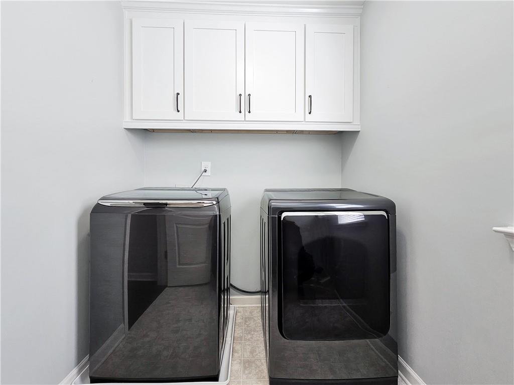 330 Avalon Square Fairburn, GA 30213 - Photo 44 of 52 a utility room with dryer and washer