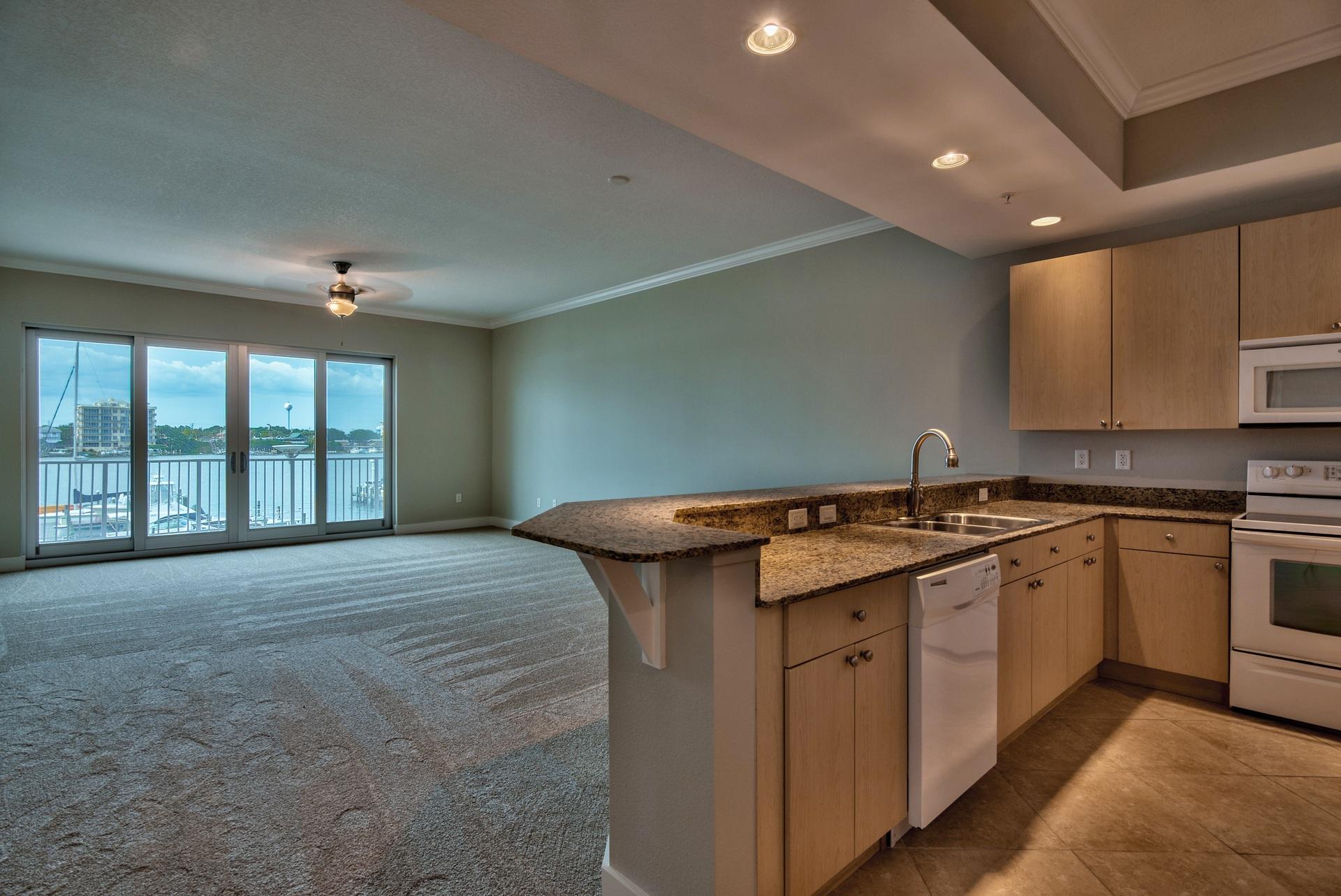 211 Durango Road, Unit 216 Destin, FL 32541 - Photo 1 of 35 a kitchen with a sink stove and cabinets