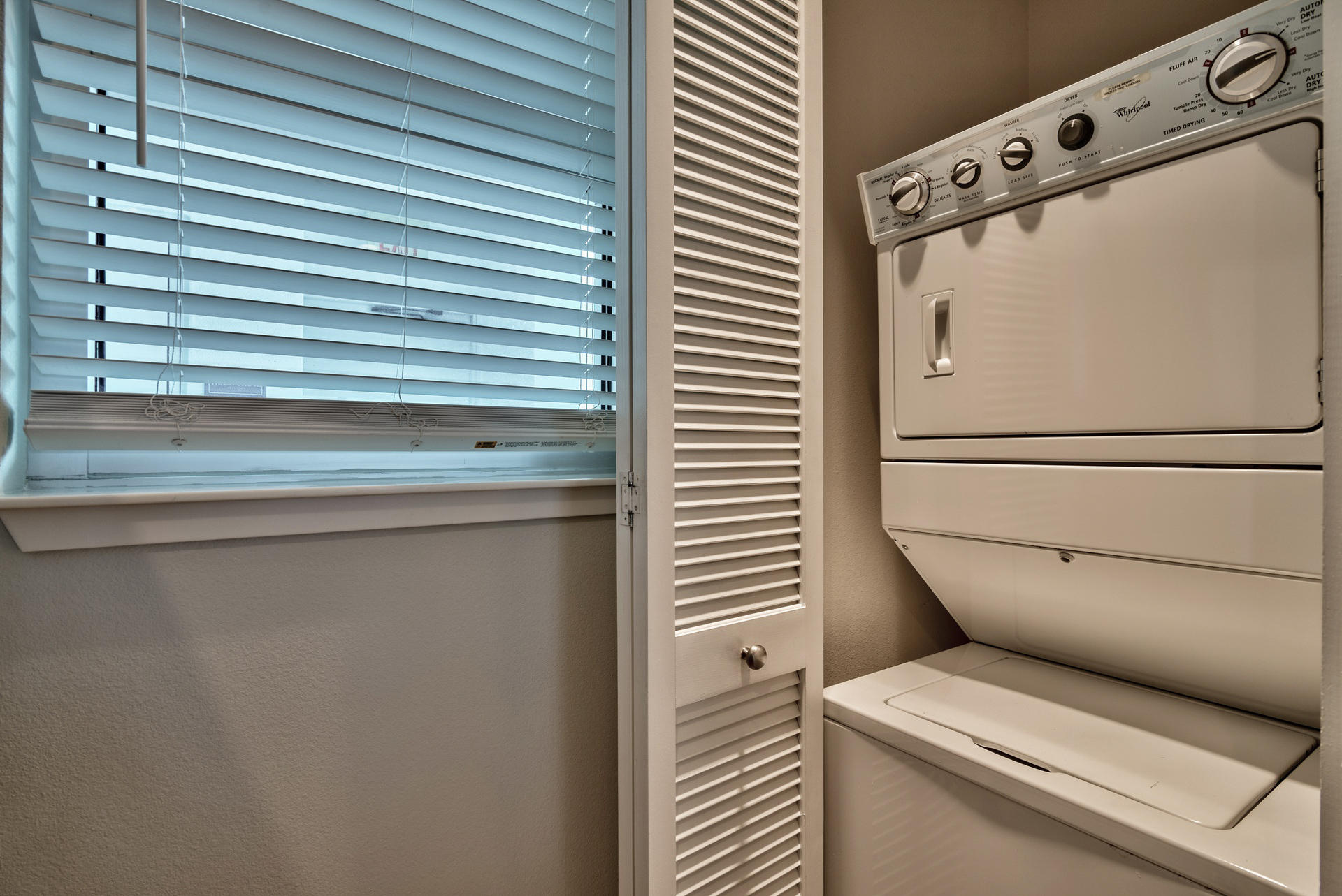 211 Durango Road, Unit 216 Destin, FL 32541 - Photo 22 of 35 a utility room with dryer and washer