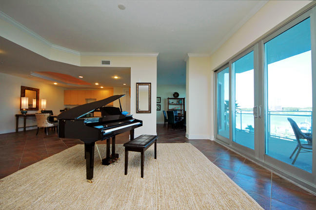 211 Durango Road, Unit 216 Destin, FL 32541 - Photo 32 of 35 a living room with furniture a pool table and a large window