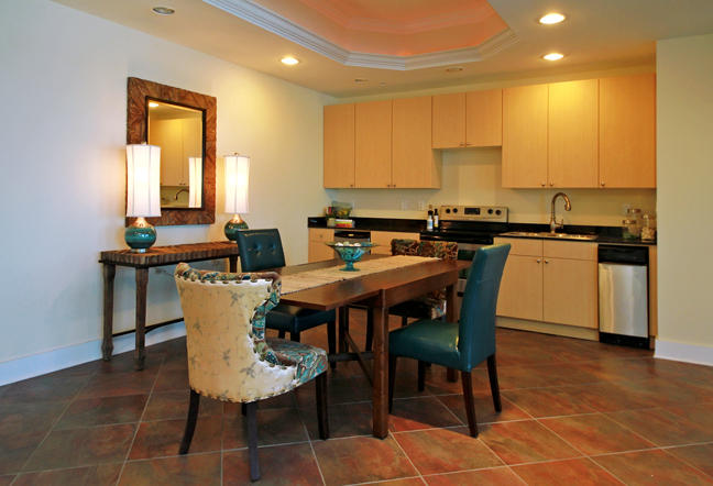 211 Durango Road, Unit 216 Destin, FL 32541 - Photo 33 of 35 a kitchen with a dining table chairs and sink