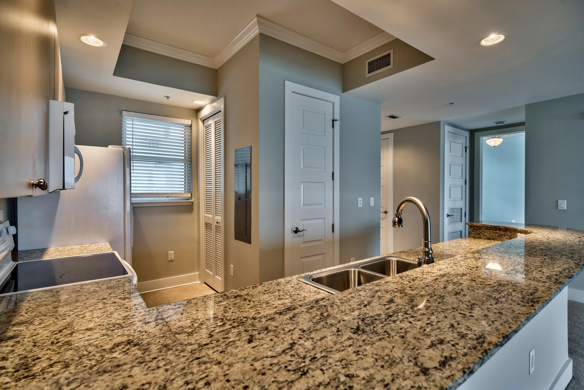 211 Durango Road, Unit 216 Destin, FL 32541 - Photo 10 of 35 a bathroom with a granite countertop sink and a mirror