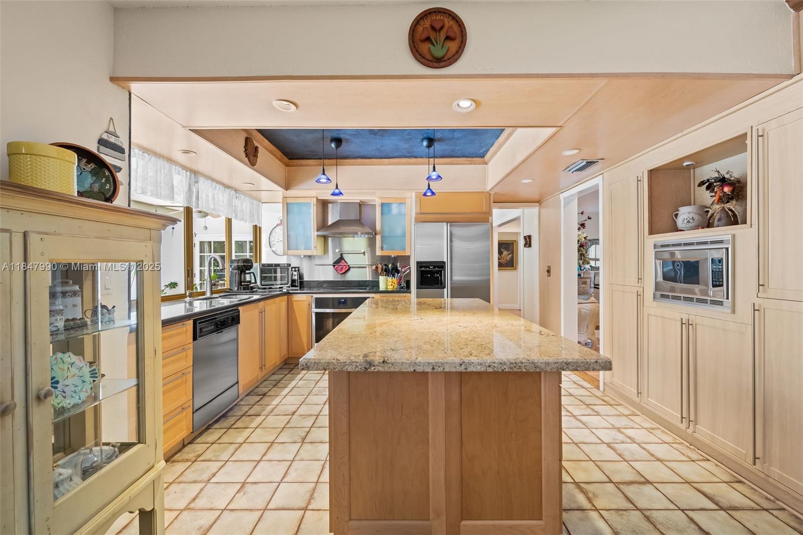 5414 West Park Road Hollywood, FL 33021 - Photo 11 of 19 a kitchen with stainless steel appliances granite countertop a refrigerator and a stove