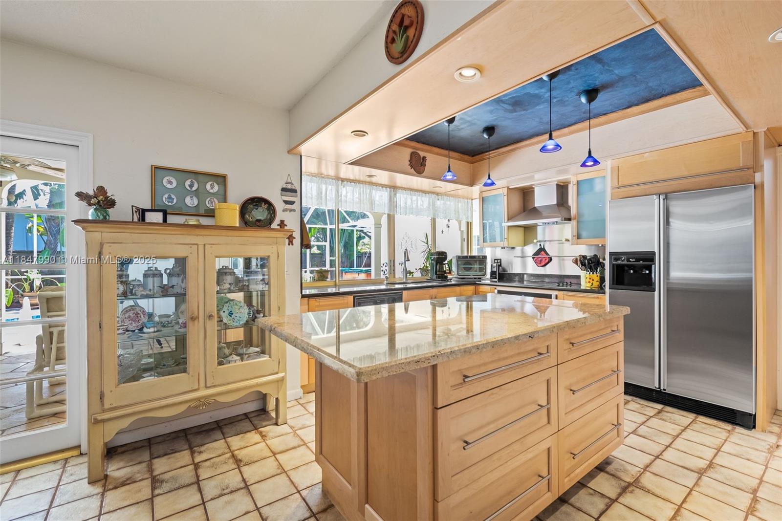 5414 West Park Road Hollywood, FL 33021 - Photo 12 of 19 a kitchen with stainless steel appliances granite countertop a sink and a refrigerator
