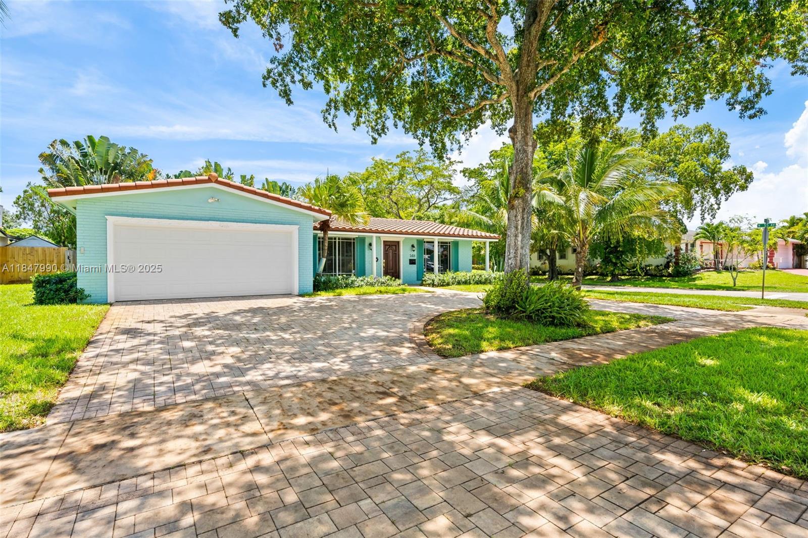 5414 West Park Road Hollywood, FL 33021 - Photo 2 of 19 a front view of a house with a yard and trees