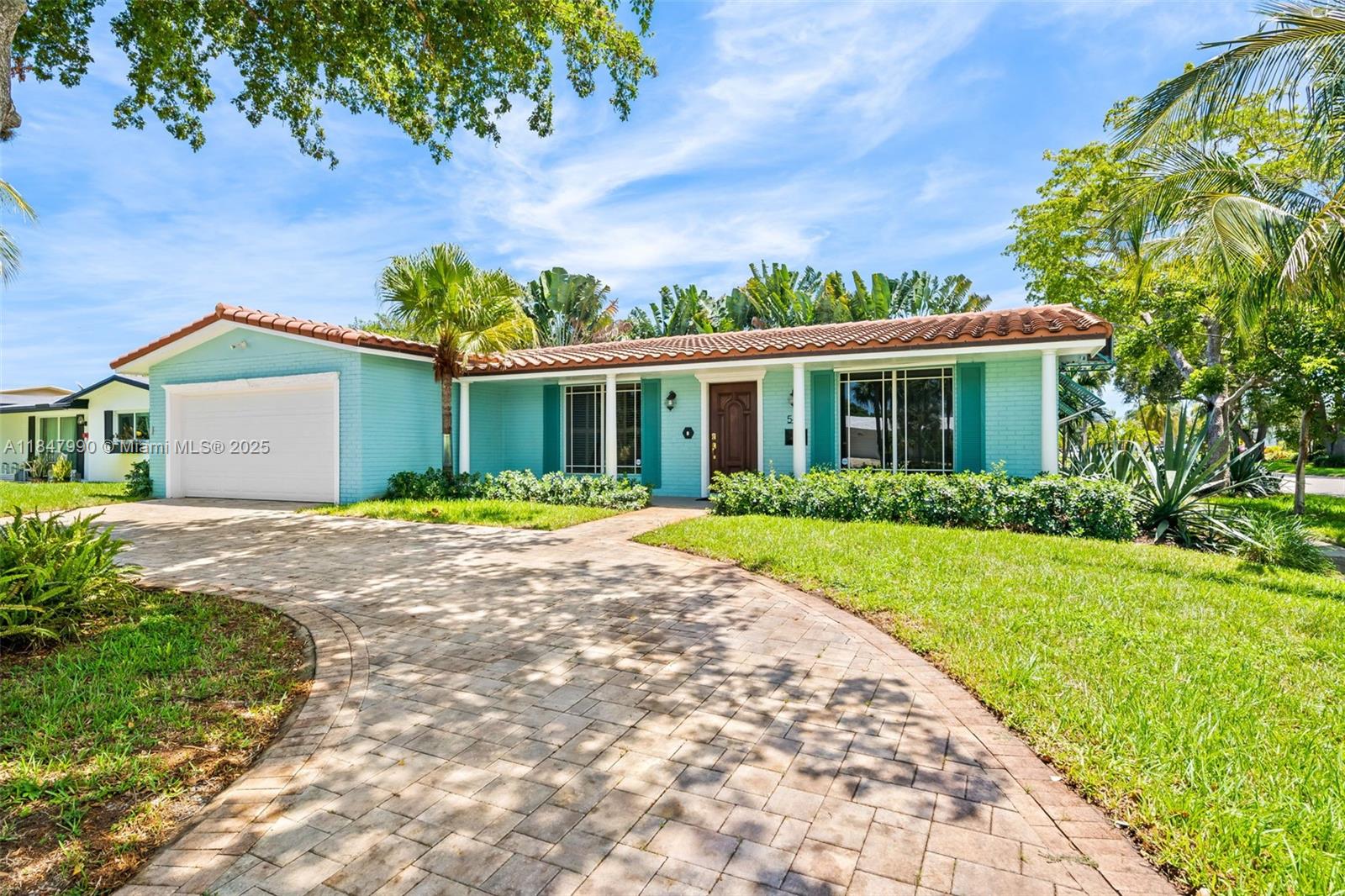 5414 West Park Road Hollywood, FL 33021 - Photo 3 of 19 a front view of a house with a yard and potted plants