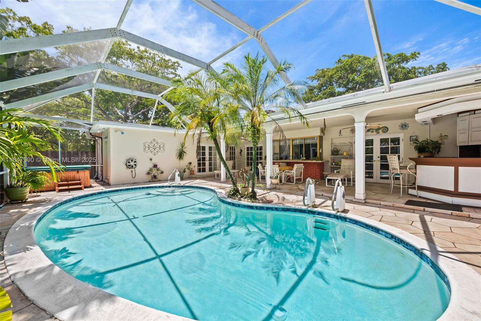 5414 West Park Road Hollywood, FL 33021 - Photo 5 of 19 a view of a swimming pool with a patio