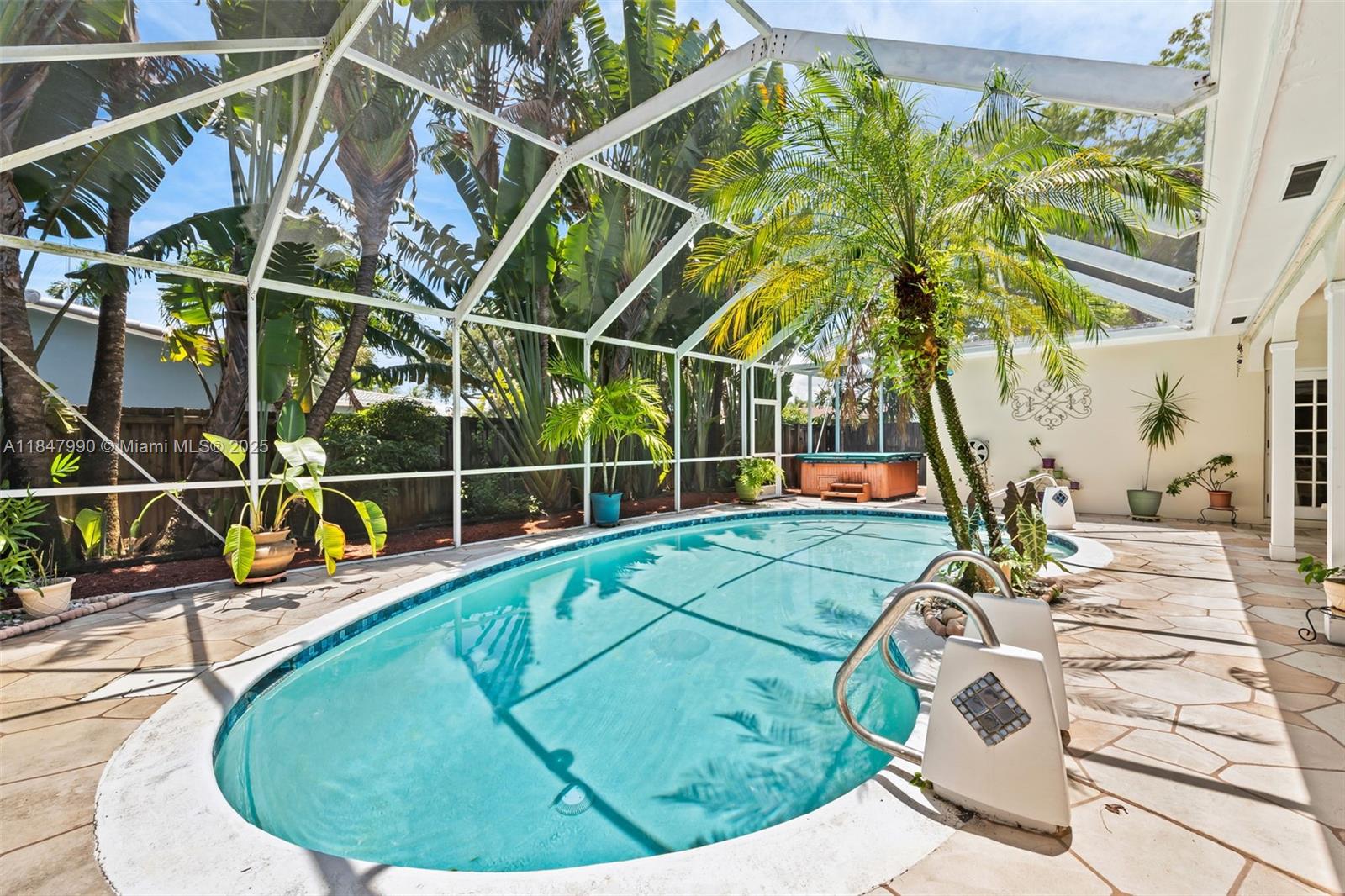 5414 West Park Road Hollywood, FL 33021 - Photo 6 of 19 a view of a swimming pool with a yard and sitting area