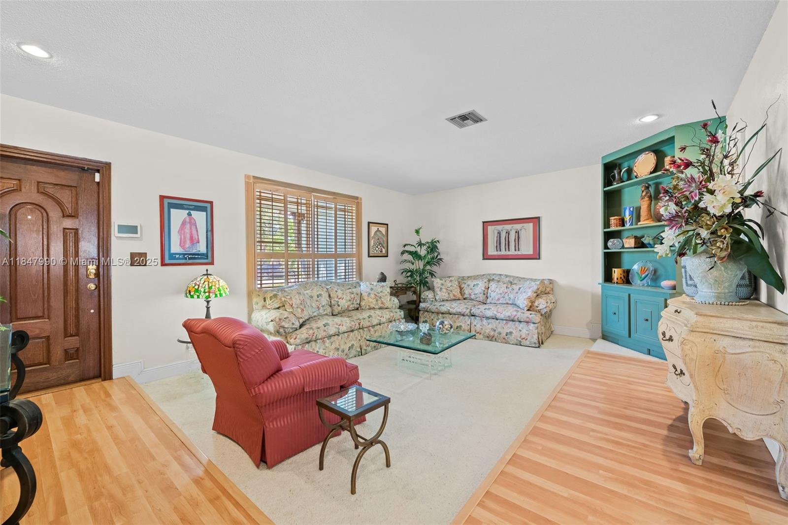 5414 West Park Road Hollywood, FL 33021 - Photo 8 of 19 a living room with furniture and a potted plant