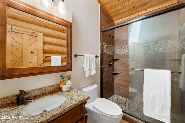 a view of entryway with wooden floor and cabinet
