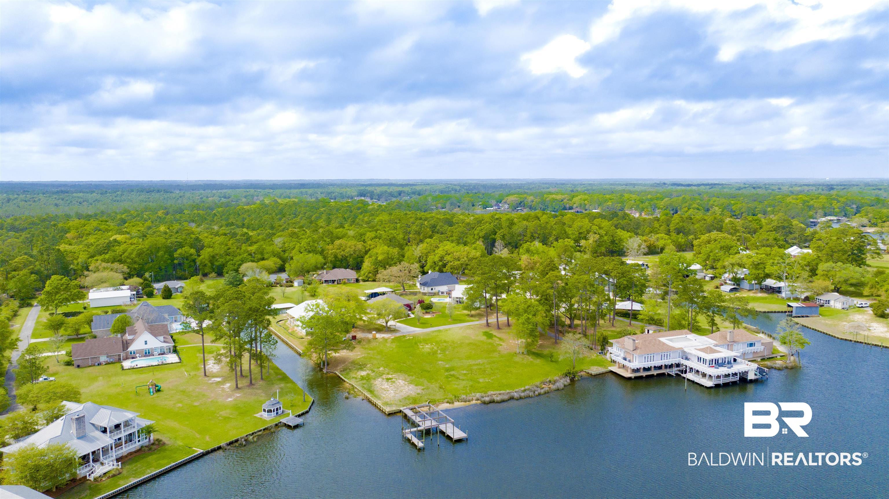 0 South Windsor Road South Theodore, AL 36582 - Photo 6 of 22 Aerial perspective of suburban area with a forest and a nearby body of water