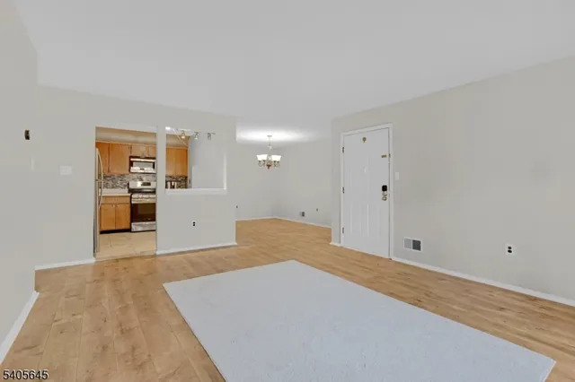 a view of kitchen with wooden floor