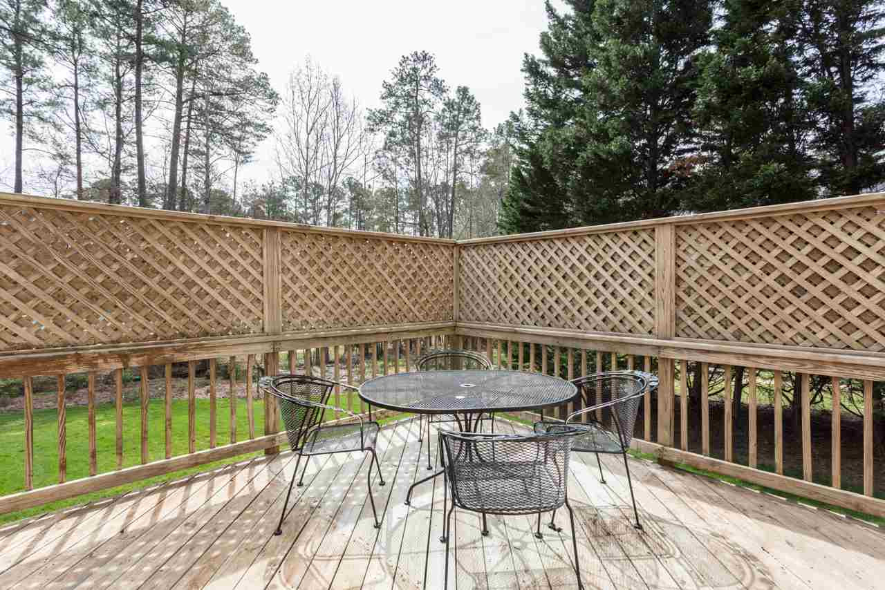 5600 Crossfield Drive Raleigh, NC 27613 - Photo 21 of 25 The home has 2 decks that are connected by a walkway. Both are accessible from the sunroom. The homeowners have used this deck for outdoor dining. Deck #2!