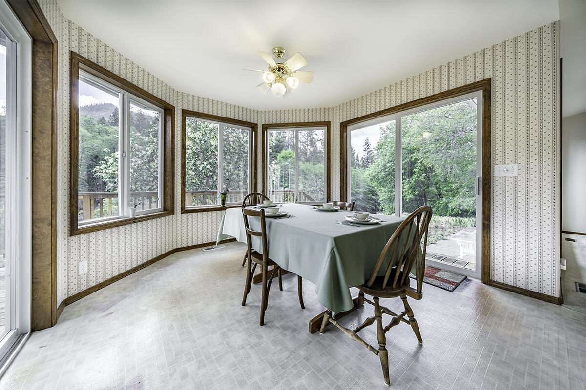 7255-7277 Upper Applegate Road Jacksonville, OR 97530 - Photo 15 of 36 a view of a dining room with furniture window and outside view