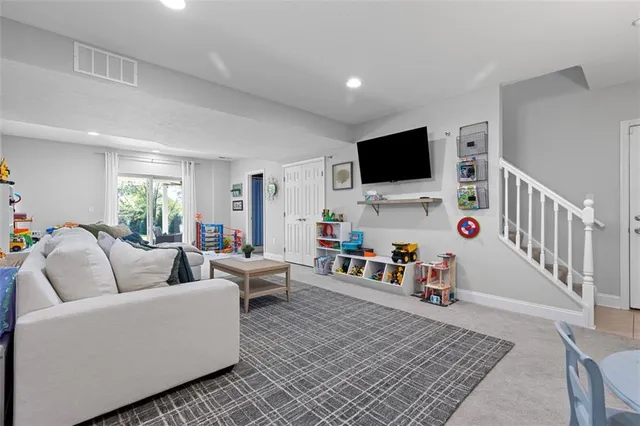 a view of deck with furniture and garden