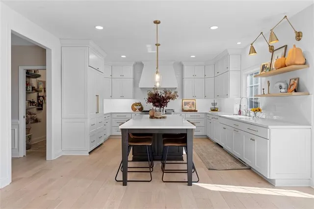 a living room with furniture and potted plant
