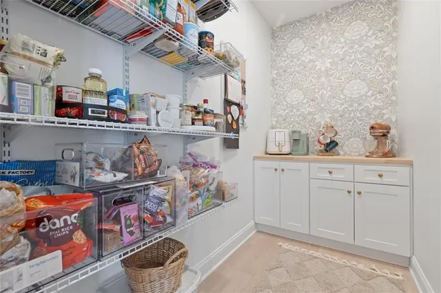 a living room with fireplace furniture and a fireplace