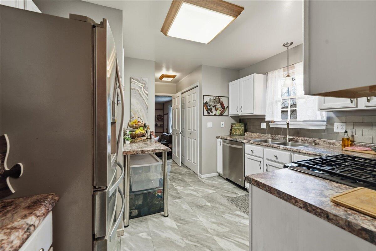 2258 Iris Street Portage, IN 46368 - Photo 12 of 29 a kitchen with a refrigerator and a stove