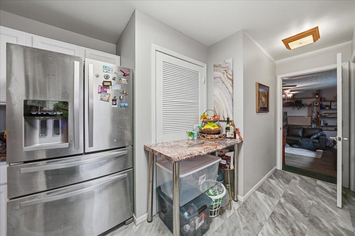 2258 Iris Street Portage, IN 46368 - Photo 13 of 29 a kitchen with stainless steel appliances granite countertop a refrigerator and a stove