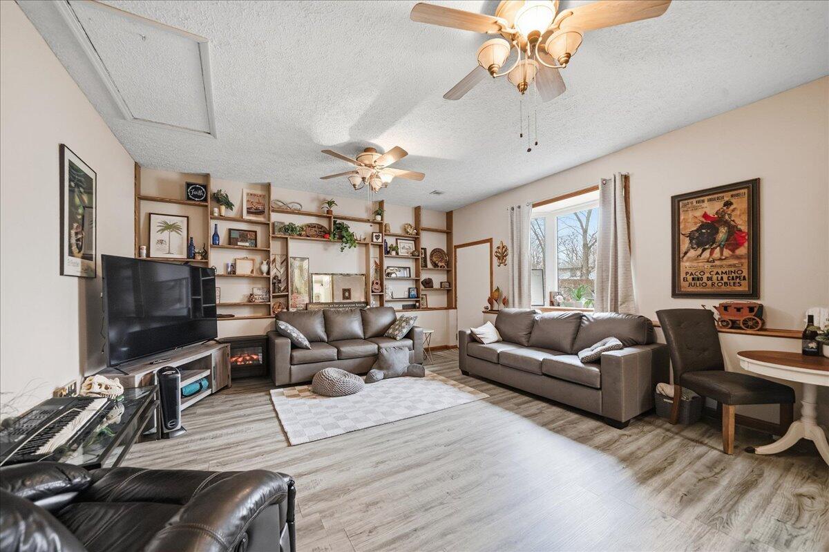 2258 Iris Street Portage, IN 46368 - Photo 16 of 29 a living room with furniture and a flat screen tv