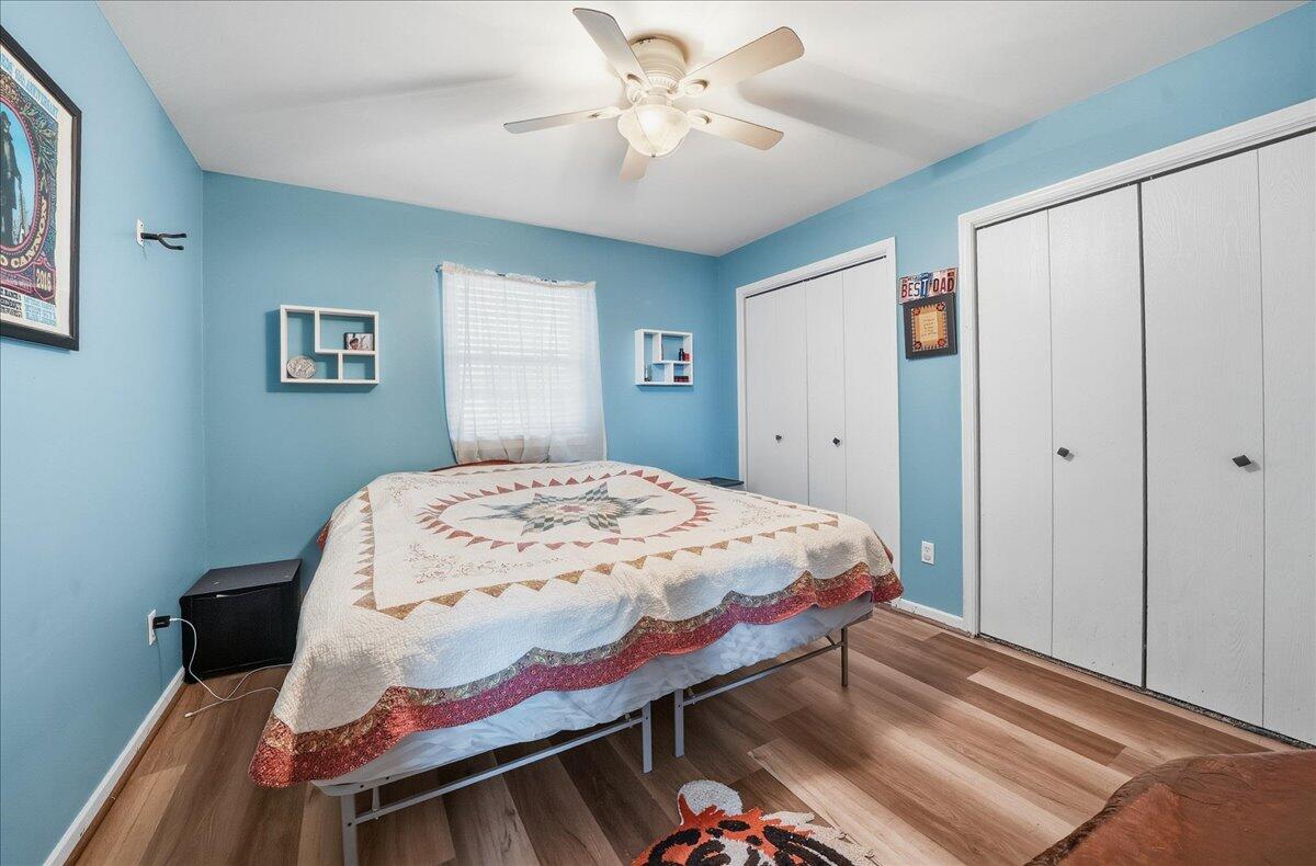 2258 Iris Street Portage, IN 46368 - Photo 21 of 29 a bedroom with a bed and a chandelier