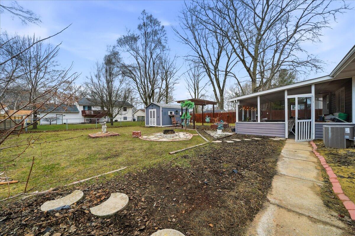 2258 Iris Street Portage, IN 46368 - Photo 23 of 29 a view of house with outdoor space and garden