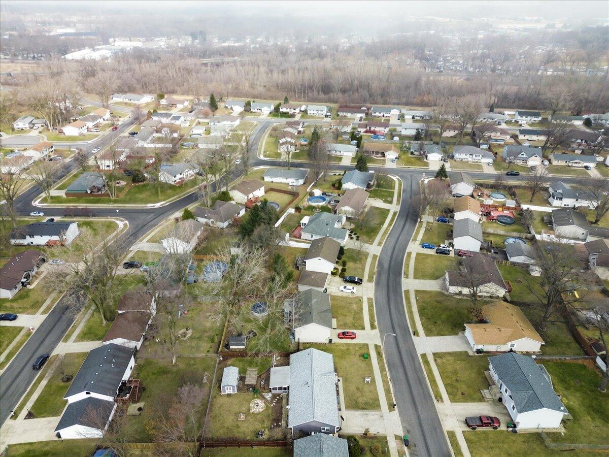 2258 Iris Street Portage, IN 46368 - Photo 29 of 29 an aerial view of residential houses with outdoor space