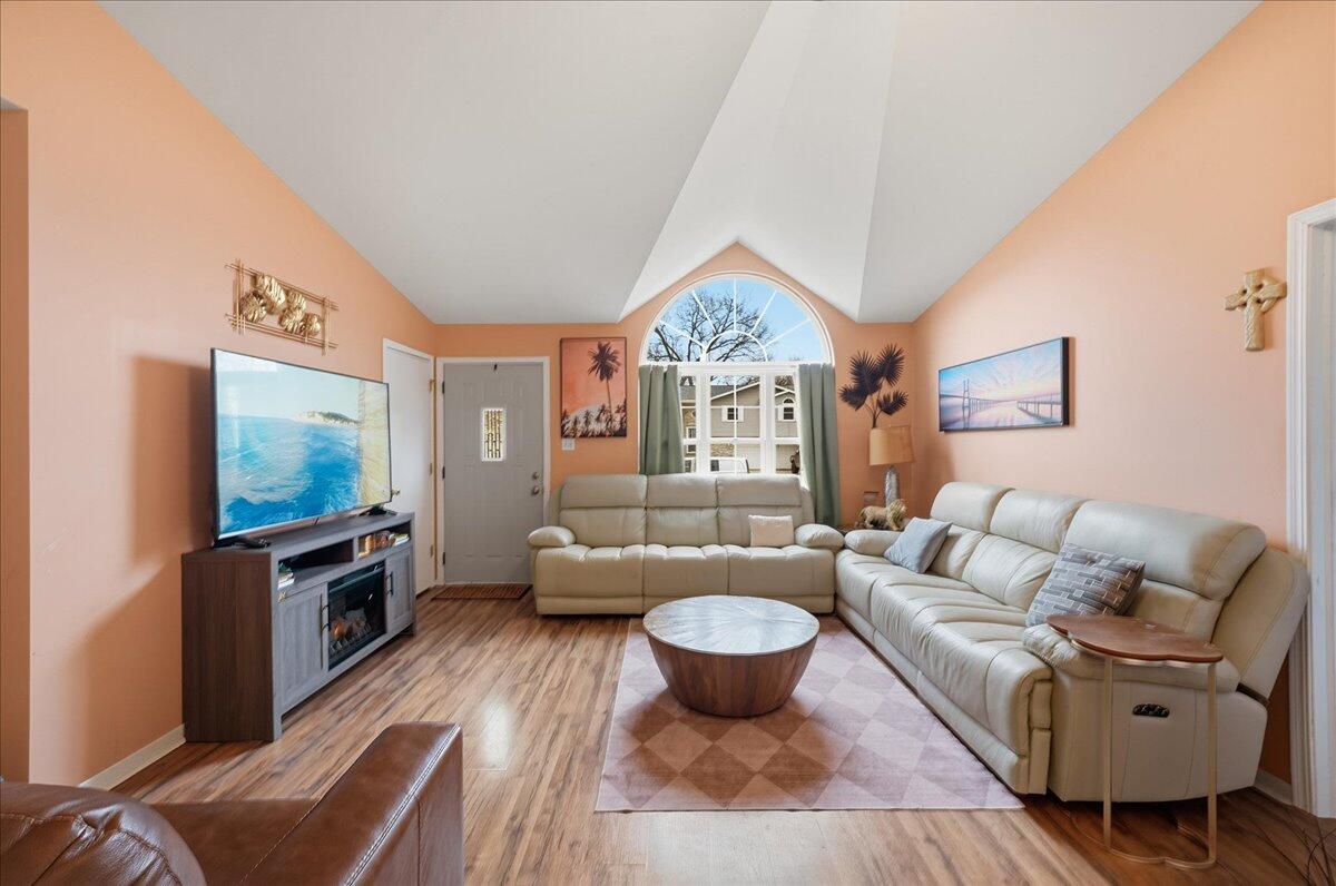 2258 Iris Street Portage, IN 46368 - Photo 3 of 29 a living room with furniture a flat screen tv and a large window