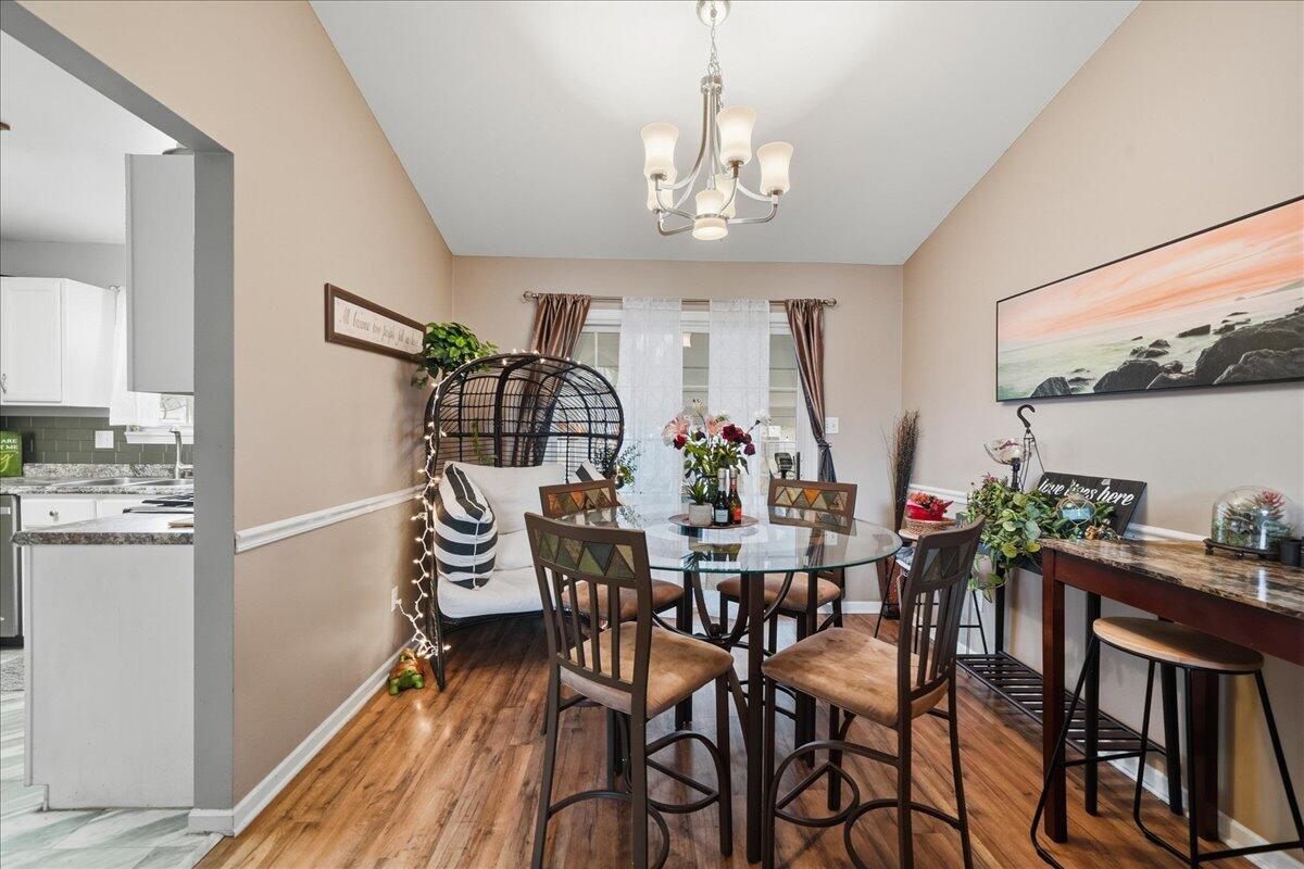 2258 Iris Street Portage, IN 46368 - Photo 10 of 29 a view of a dining room with furniture and chandelier